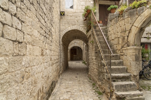 Narrow alley in the old town centre of Trogir, Croatia, Europe