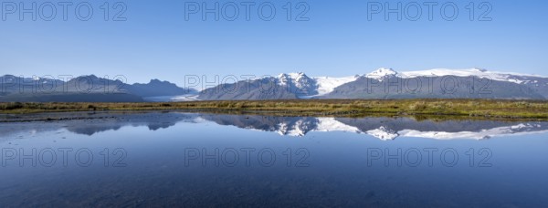 Reflection in a lake, view of Svínafellskökull glacier tongue, glaciated mountain peak Hrútfjallstindar, Vatnajökull National Park, Austurland, Iceland, Europe