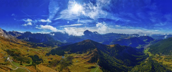 The Picberg, in the background the peaks of the Sassolungo Group, shrouded in mist, wide-angle panoramic shot, drone shot, Val Gardena, Dolomites, Autonomous Province of Bolzano, South Tyrol, Italy, Europe