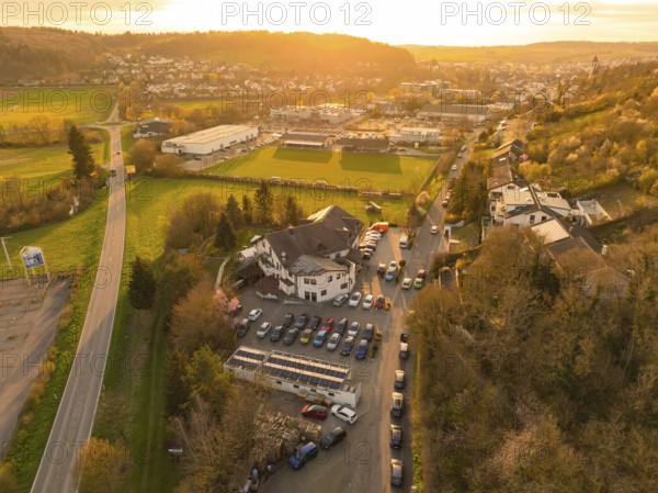 Urban landscape with an accentuated sunset over the fields and buildings, Europäischer Hof, Königsbach, Germany, Europe