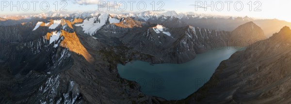 Evening mood, mountain panorama, aerial view, 4000 metre peak with glacier, mountain pass and mountain lake Ala-Kul Lake, Tien Shan, Kyrgyzstan, Asia