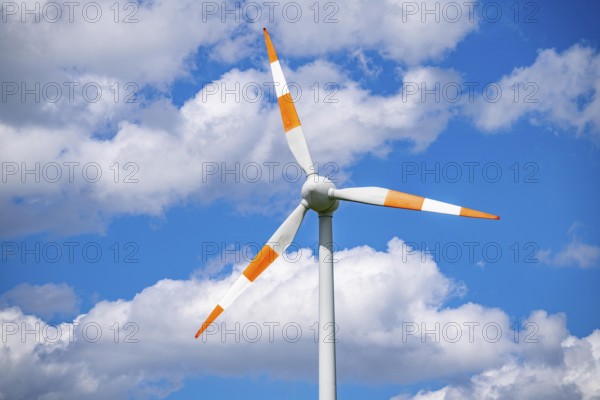 Wind turbine, wind energy plant from the manufacturer Enercon, blue sky with many white clouds, near Schermbeck, North Rhine-Westphalia, Germany, Europe