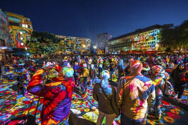 Essen Light Festival, in the city centre, light art on Kennedyplatz, the Berlin artist Daniel Margraf illuminates the large square in the city centre with works of art from the Essen Folkwang Museum, the visitors become part of the pictures that change with every step. North Rhine-Westphalia, Germany, Europe