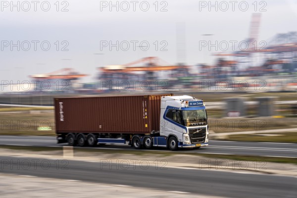 Container lorry, bringing containers from Euromax Container Terminal, the seaport of Rotterdam, Netherlands, deep-sea port Maasvlakte 2, on an artificial land area off the original coastline
