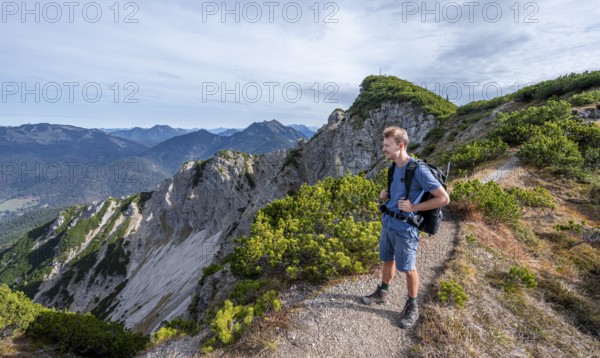 Hiker on hiking trail, Bayrischer Schinder, Tegernsee mountains in the Mangfall mountains, Germany, Europe