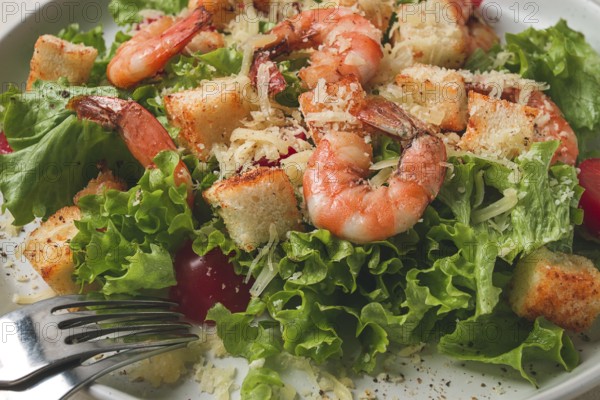 Caesar salad, with shrimp, on a white background, homemade, no people