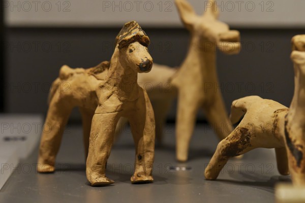 Antique children's toy, Handmade clay figure of a horse from historical times in close-up, Archaeological Museum, Archea Korinthos, Corinth, Peloponnese, Greece, Europe