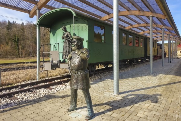 Durlesbach railway station, opened in 1849 and decommissioned in 1984, railway monument, railway memorial, group of figures by the artist René Auer, group of sculptures, scene from the song Auf de schwäbische Eisebahne, conductor, Konduktör, s Weible, Frau, bronze figures, Königlich Württembergische Staats-Eisenbahnen, art in public space, Durlesbach, Reute, Bad forest lake, Upper Swabia, Baden-Württemberg, Germany, Europe