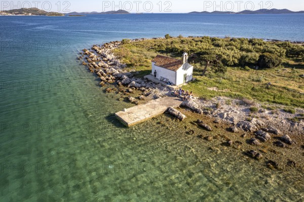 The island of Sveta Justina with the church of St Justina seen from the air, Pakostane, Croatia, Europe