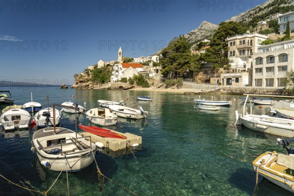 Harbour and church in Pisak on the Omis Riviera, Croatia, Europe