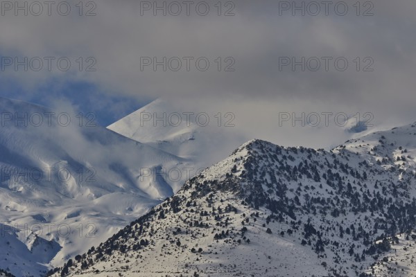 Snow-covered mountain range under a cloudy sky, Lefka Ori, White Mountains, mountain massif, west, Crete, Greece, Europe