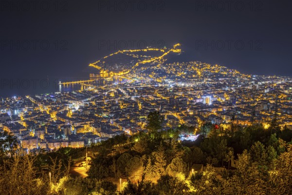 The lights of the city of Alanya on the Turkish Riviera glow in the evening, Alanya, Antalya, Turkey, Asia