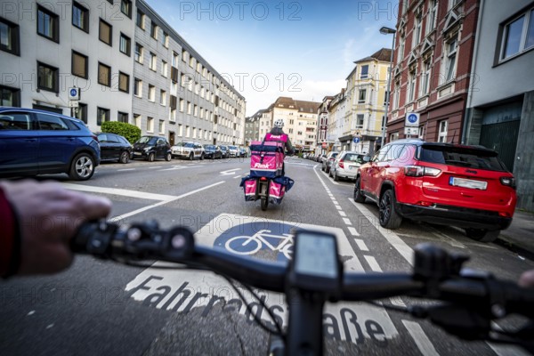 Cycling in the city, city centre road, cycle lane, two-wheeled traffic has priority, 30 km/h zone, cyclists' perspective, Essen, North Rhine-Westphalia, Germany, Europe