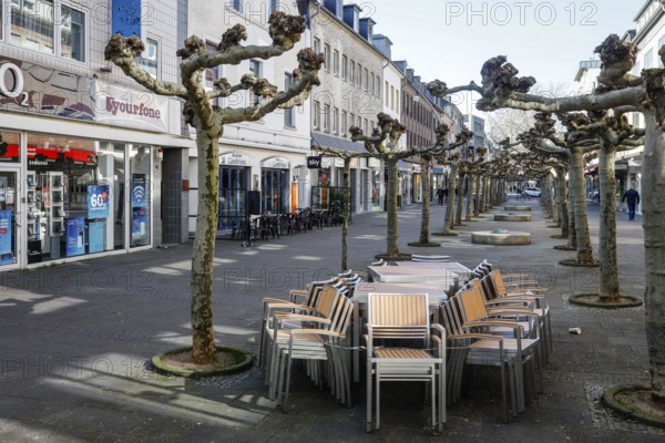 Deserted shopping street with closed shops due to corona pandemic contact ban, main street in the old town, Viersen, Lower Rhine, North Rhine-Westphalia, Germany, Europe