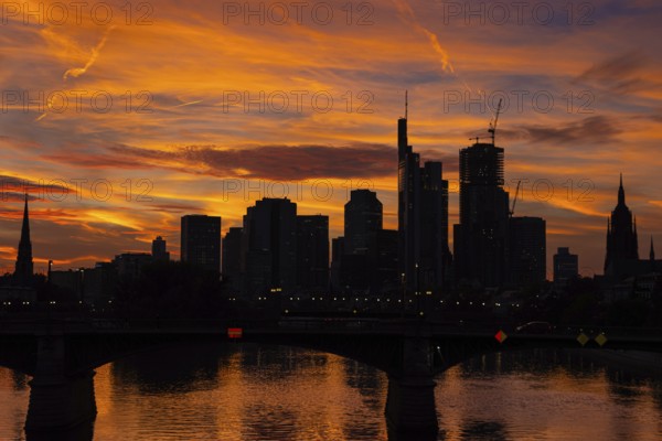 The silhouette of Frankfurt's banking skyline stands out against the luminous evening sky in the evening after sunset., Frankfurt am Main, Hesse, Germany, Europe