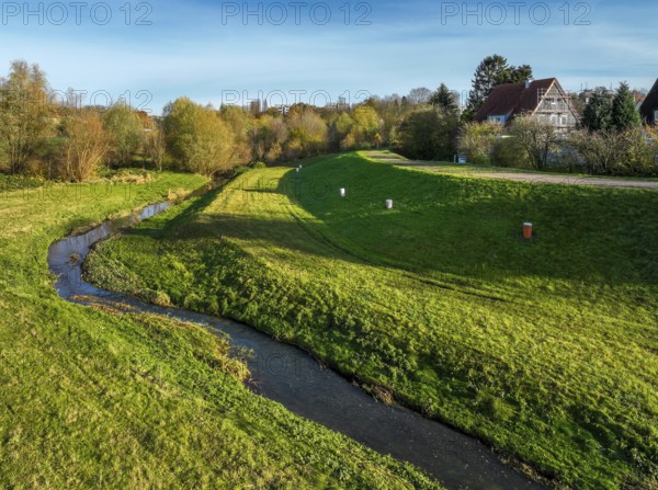 Dortmund, North Rhine-Westphalia, Germany, Renaturalised Emscher in Dortmund Aplerbeck. The river was transformed into a near-natural watercourse, flood protection and biodiversity through newly designed floodplains, here in the flood retention basin HRB Dortmund Nagelpötchen. Following the construction of a parallel sewer, the Emscher is now free of wastewater, having previously been an open, above-ground wastewater sewer, combined sewer with surface water and wastewater, Europe