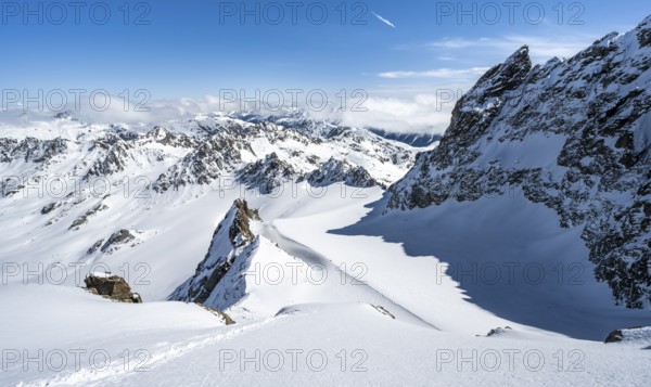 Mountain ridge of Piz Kesch, ascent on Piz Kesch or Piz d'Es-cha in winter, spectacular mountain landscape, view of mountain panorama with glacier Vadret da Porchabella, Albula Alps, Rhaetian Alps, Grisons, Eastern Switzerland, Switzerland, Europe