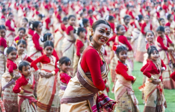 An instructor dance as participants follows the dance step in a Bihu dance workshop ahead of Rongali Bihu Festival, in Guwahati, India on 8 April 2025