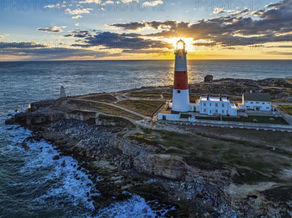 Sunset over Portland Bill Lighthouse from a drone, Portland Bill, Isle of Portland, Dorset, England, United Kingdom, Europe