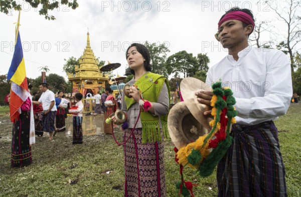 NAMSAI, INDIA.- APRIL 16: Devotees celebrate the vibrant Sangken Festival at Golden Pagoda in Namsai, India on 16 April 2025. Sangken Festival is a beautiful and culturally rich water festival celebrated primarily by the Theravada Buddhist communities, it marks the Buddhist New Year, typically falling in mid-April