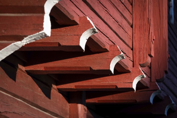 Detail of falun red painted wooden construction, detail of traditional Norwegian wooden granary or Stabbur, pilgrim hostel Arteid Vestre Gård, Norway, Europe