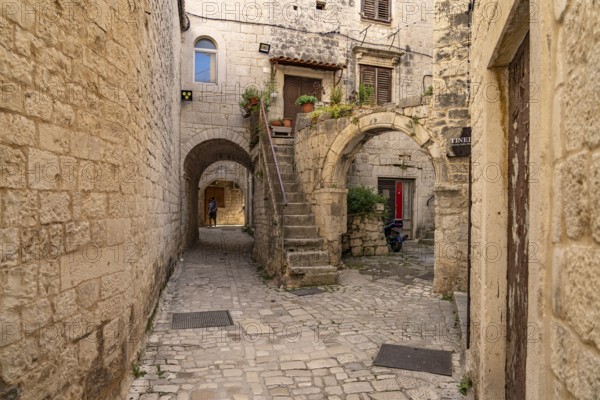 Narrow alley in the old town centre of Trogir, Croatia, Europe