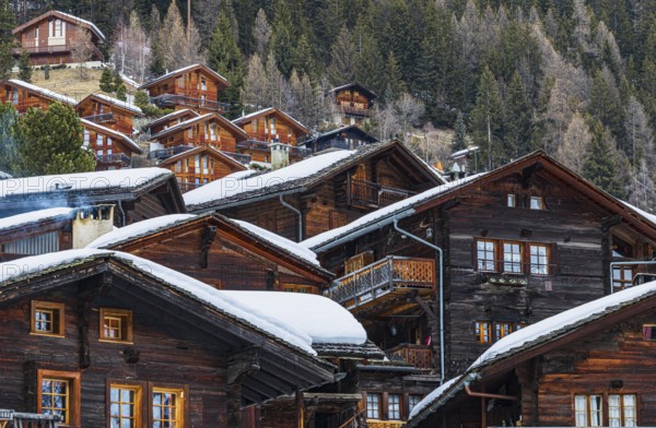 Old wooden houses with snow-covered roofs in the historic village centre, Grimentz, Val d'Anniviers, Valais Alps, Canton Valais, Switzerland, Europe