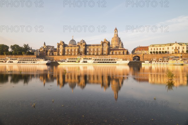 Silhouette of the Old Town with reflection in the Elbe in the morning, steamboats on the Terrassenufer, Brühl's Terrace, Academy of Fine Arts and Church of Our Lady, Dresden, Saxony, Germany, Europe