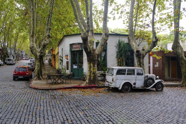 Colonia del Sacramento, Colonia, Uruguay, vintage cars parked in the alleyways of the old town. Colonia del Sacramento is a city on the Río de la Plata in Uruguay. It is the capital of the department of Colonia. Colonia del Sacramento is the oldest city in Uruguay and its historic centre, a popular tourist destination, has been declared a UNESCO World Heritage Site, South America
