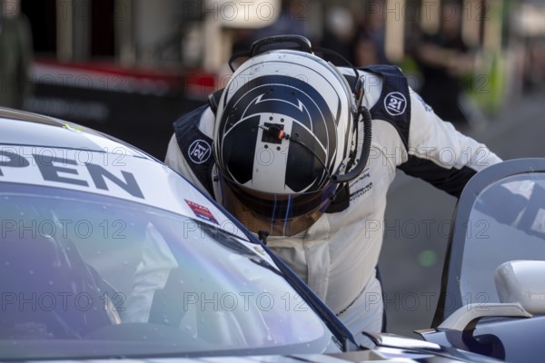 10 May 2024, Hockenheimring Germany : Michael Blanchemain France climbs into the cockpit of his car (GT Open)