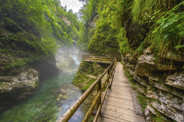 Breathtaking scenery of vintgar gorge with wooden walkways and turquoise water, a popular tourist attraction near bled, slovenia