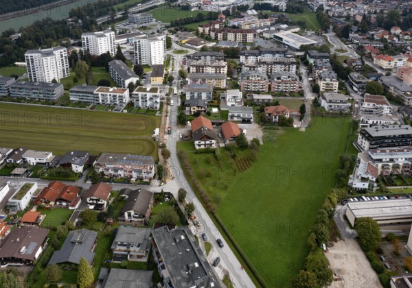 Drone image, grassland between built-up residential area, residential buildings and high-rise buildings, city view of Kufstein, Tyrol, Austria, Europe