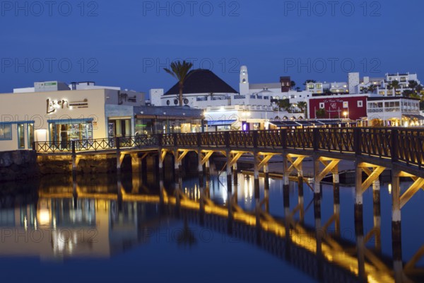 Marina Rubicon marina with illuminated bridge and reflections in the water, Playa Blanca, Lanzarote, Canary Islands, Spain, Europe