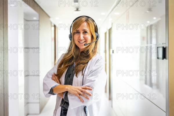 Portrait of a proud female hospital receptionist wearing headset to work