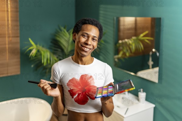 Portrait of a latin young gay smiling man making up at home