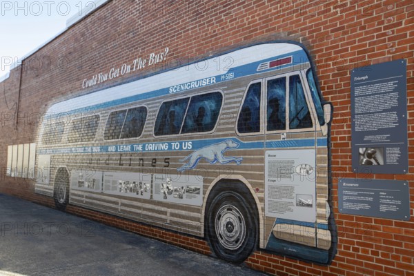 Anniston, Alabama - A mural of a Greyhound bus outside the Freedom Riders National Monument. In the early 1960s, integrated groups of riders rode Greyhound and Trailways buses through the South to challenge racial segregation in interstate transportation. The riders were beaten, and arrested. In Anniston, a bus was burned