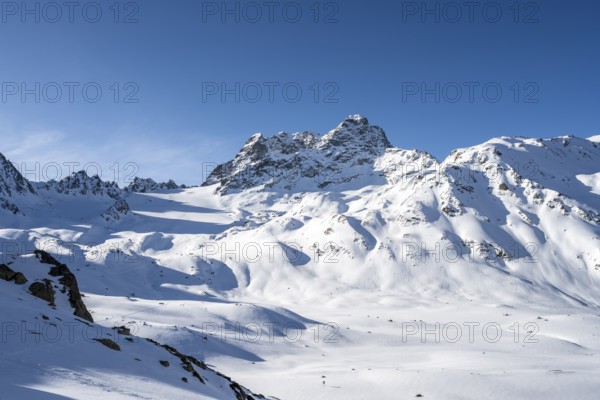 Mountain peak Piz Kesch with snow, view at the Kesch hut in winter, Grisons Haute Route, Albula Alps, Rhaetian Alps, Grisons, Eastern Switzerland, Switzerland, Europe
