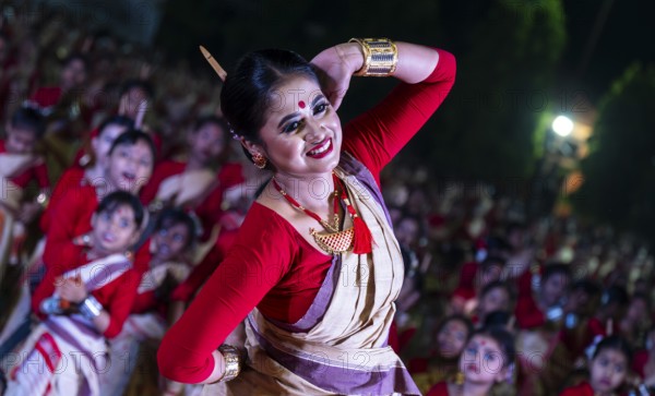An instructor dance as participants follows the dance step in a Bihu dance workshop ahead of Rongali Bihu Festival, in Guwahati, India on 8 April 2025