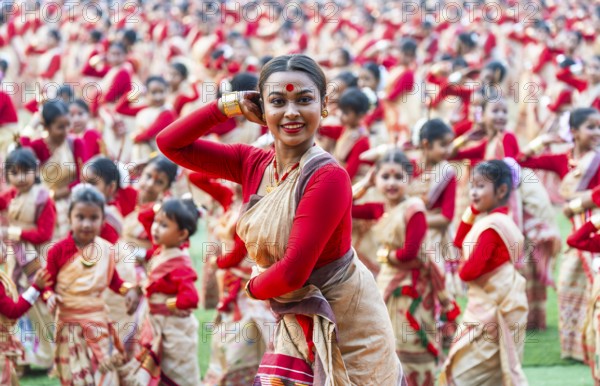 An instructor dance as participants follows the dance step in a Bihu dance workshop ahead of Rongali Bihu Festival, in Guwahati, India on 8 April 2025