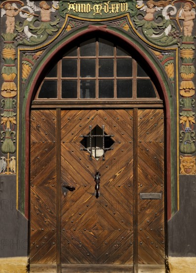 Historic wooden door with carvings on the half-timbered house Lange Bank from 1889 in the Old Town, UNESCO World Heritage Site, Goslar, Lower Saxony, Germany, Europe