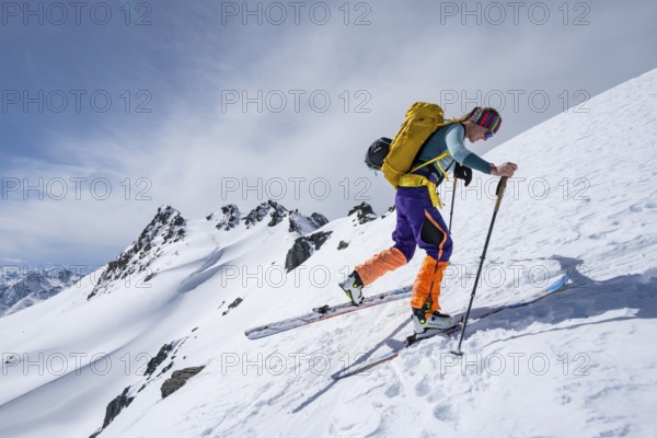Ski tourer making a hairpin bend, Graubünden Haute Route, Ascent to the Scalettahorn, Snow-covered mountains, Winter in the Albula Alps, Graubünden, Switzerland, Europe