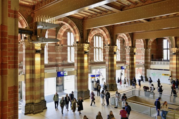 Interior view of Centraal Station, Central Station with flag, Amsterdam, Netherlands