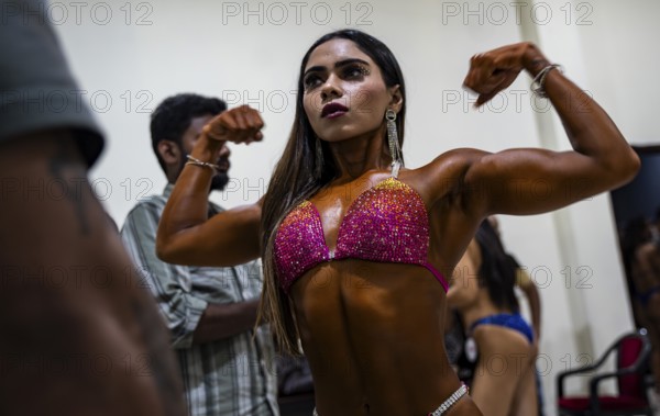 Female participants gets ready backstage as they prepare for the 4th Ms Saraighat all India classic body building championship on March 23, 2025 in Guwahati, India, Asia
