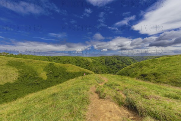 Panoramic viewpoint EL CRUCERO overlooking the green hills. Beautiful landscape of green hills with clouds and blue sky