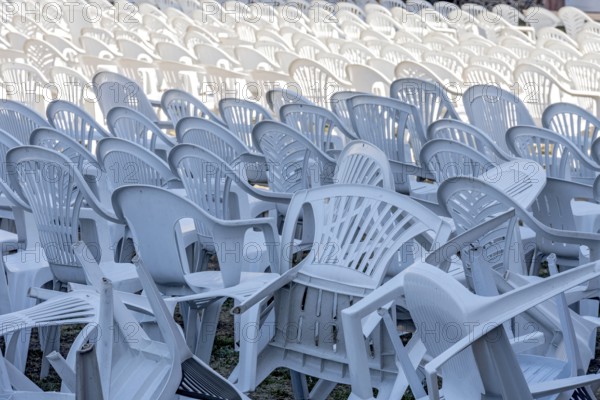 Seating for outdoor event, rows of chairs, overturned garden chairs made of plastic, plastic, monobloc design, disturbed order, clutter, Butzbach, Wetterau, Hesse, Germany, Europe