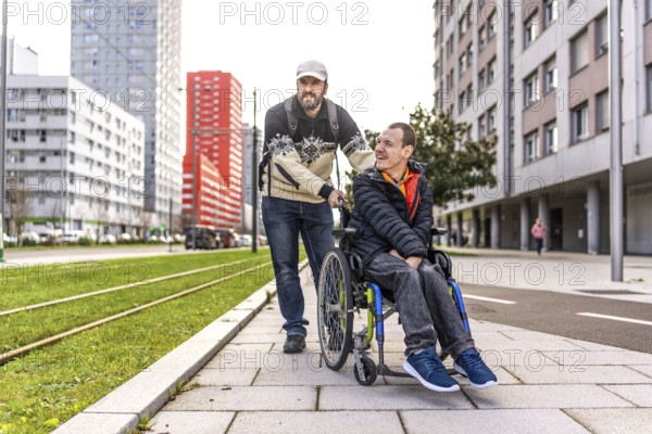 Caregiver pushing a smiling disabled man in a wheelchair along a bustling city sidewalk, enjoying a moment of friendship and support