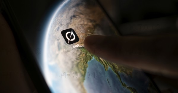 In this photo illustration, a person uses Grok AI chatbot on a mobile phone on March 21, 2025 in Guwahati, India. Elon Musk's AI chatbot, Grok, has recently become a topic of significant discussion in India due to its use of Hindi slang and unfiltered language in its responses