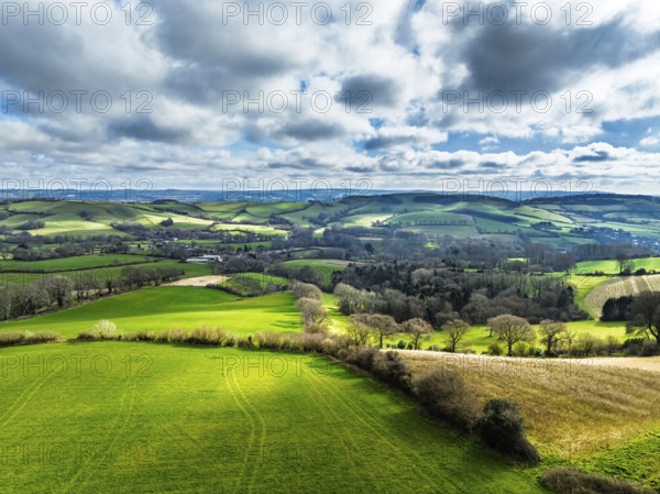 Farms over Road A35 from a drone, Morcombelake Village, Bridport, Dorset, England, United Kingdom, Europe