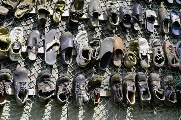 Shoes fished out of the sea by beachcombers, Maritime and Beachcomber Museum Flora, the world's largest museum of flotsam and jetsam, De Koog, Holland, Netherlands