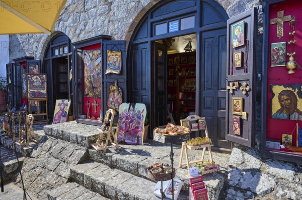 An art shop with icons and paintings displayed on a stone staircase, Chora, Patmos main town, Patmos, Old Town, Dodecanese, Greek Islands, Greece, Europe